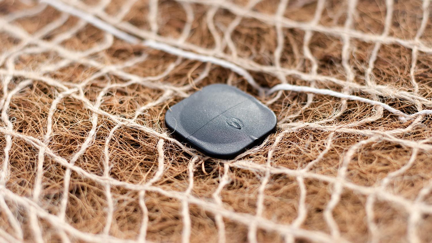 Pinning coconut and jute matting to the ground