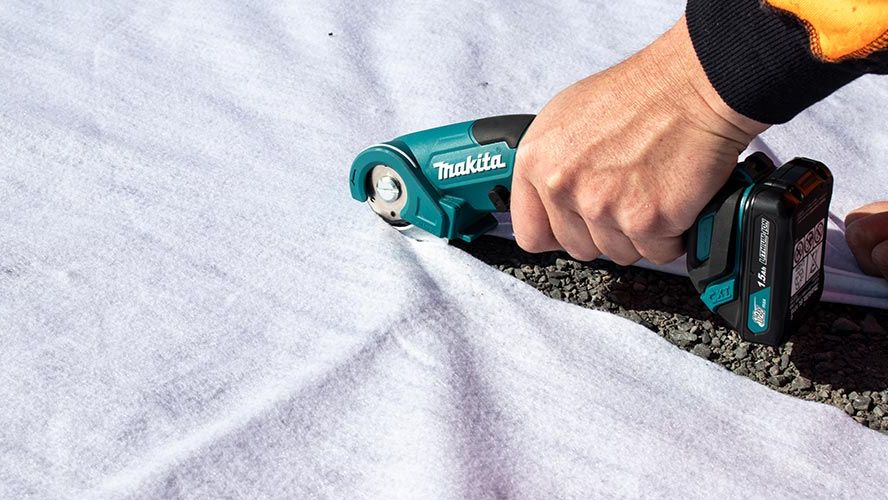 Cutting geotextile fabric