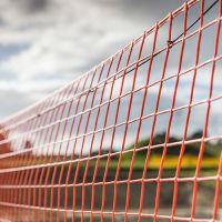 Orange barrier mesh fencing off a work area