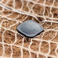 Pinning coconut and jute matting to the ground